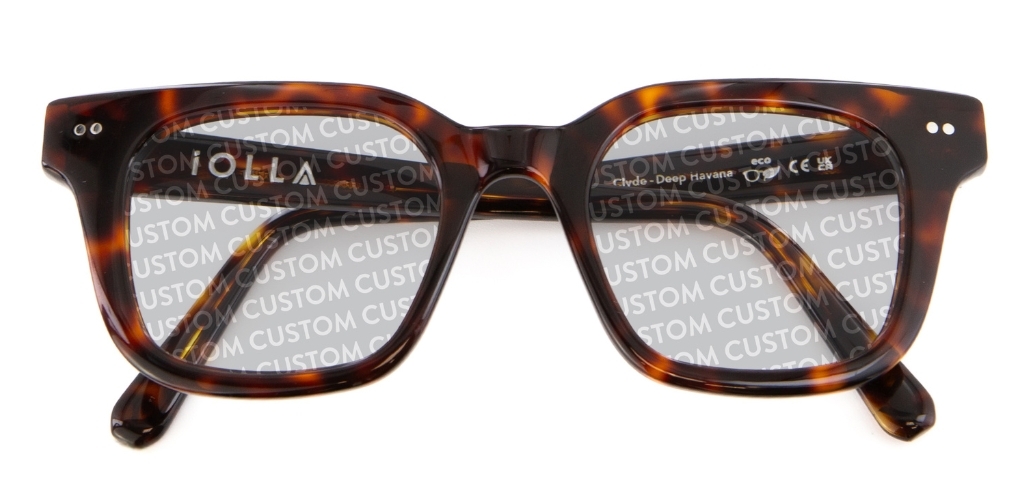 Dark tortoiseshell IOLLA folded sunglasses with custom writing on lenses on white background