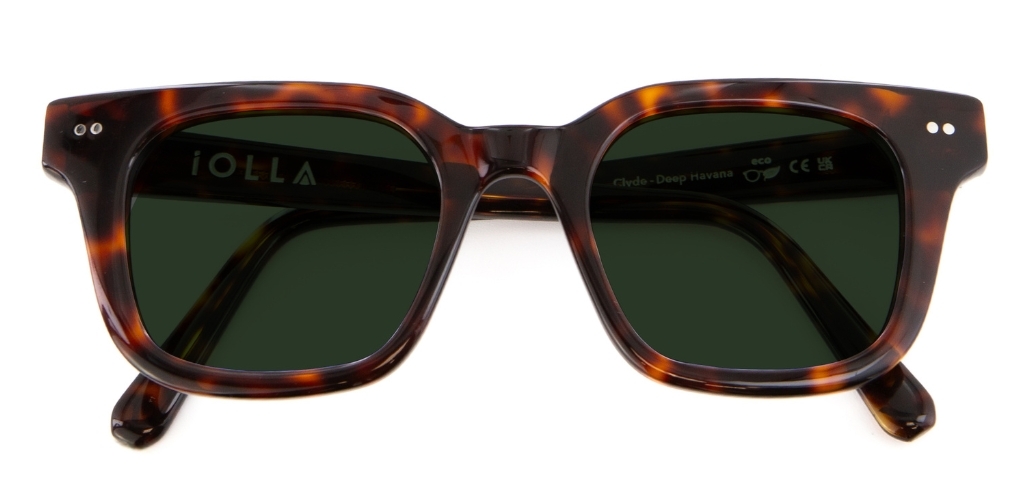 Dark tortoiseshell IOLLA sunglasses with green lenses folded on white background