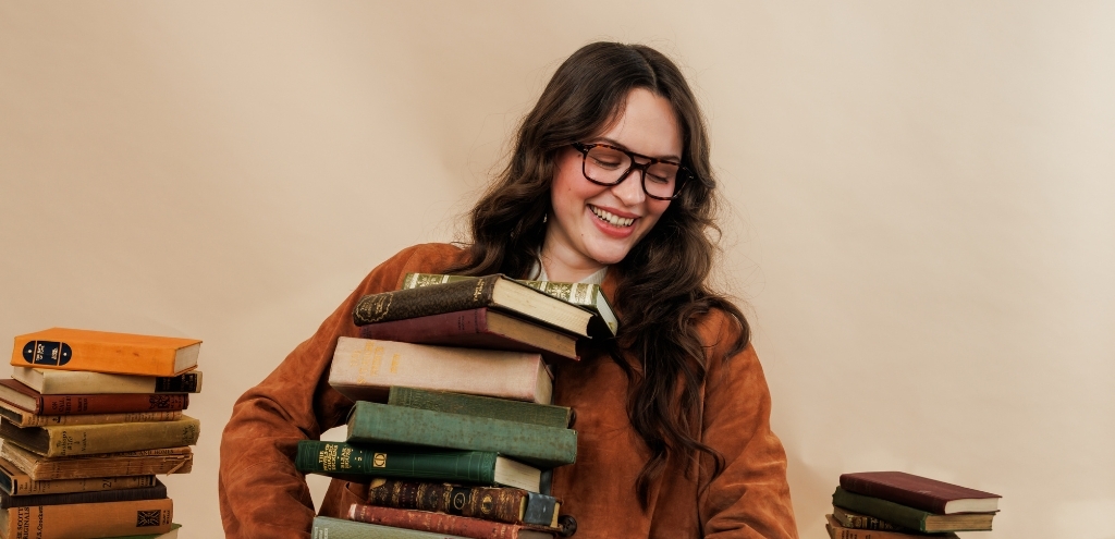 Woman wearing havana brown acetate aviator style prescription glasses, stylish full-rim frame available in the UK.