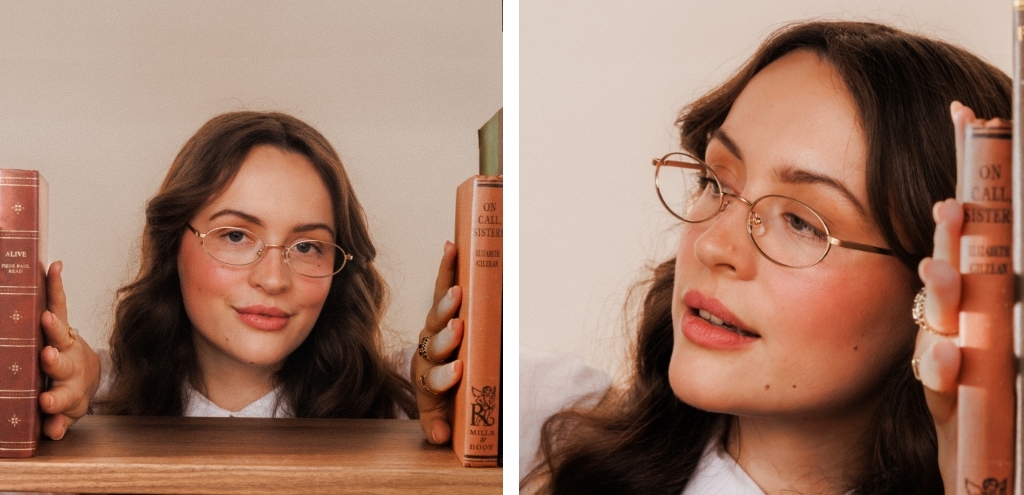 Model wearing gold metal oval glasses with slim wire frame and lightweight design.