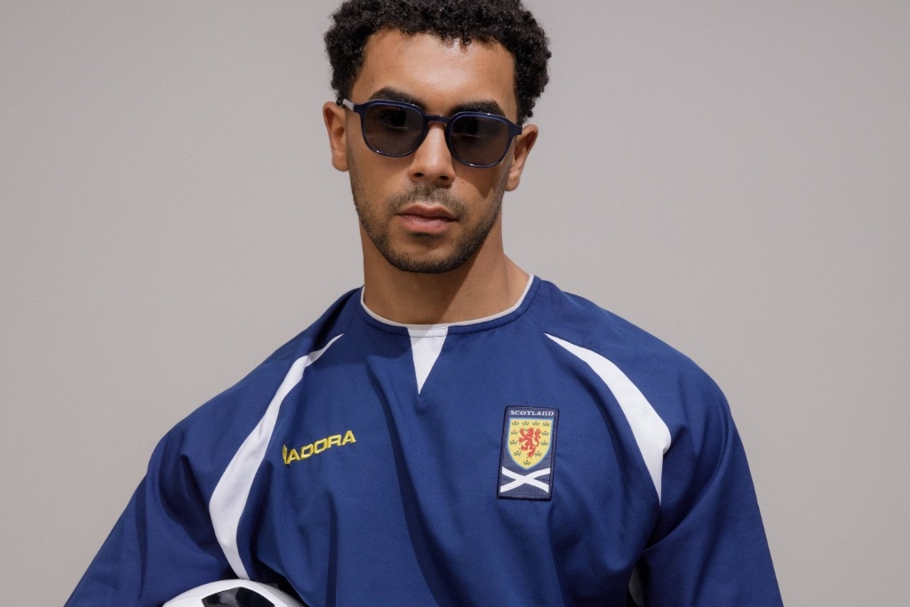 Male model showcasing IOLLA Boyd Stone Blue Sunglasses with Grey Lenses