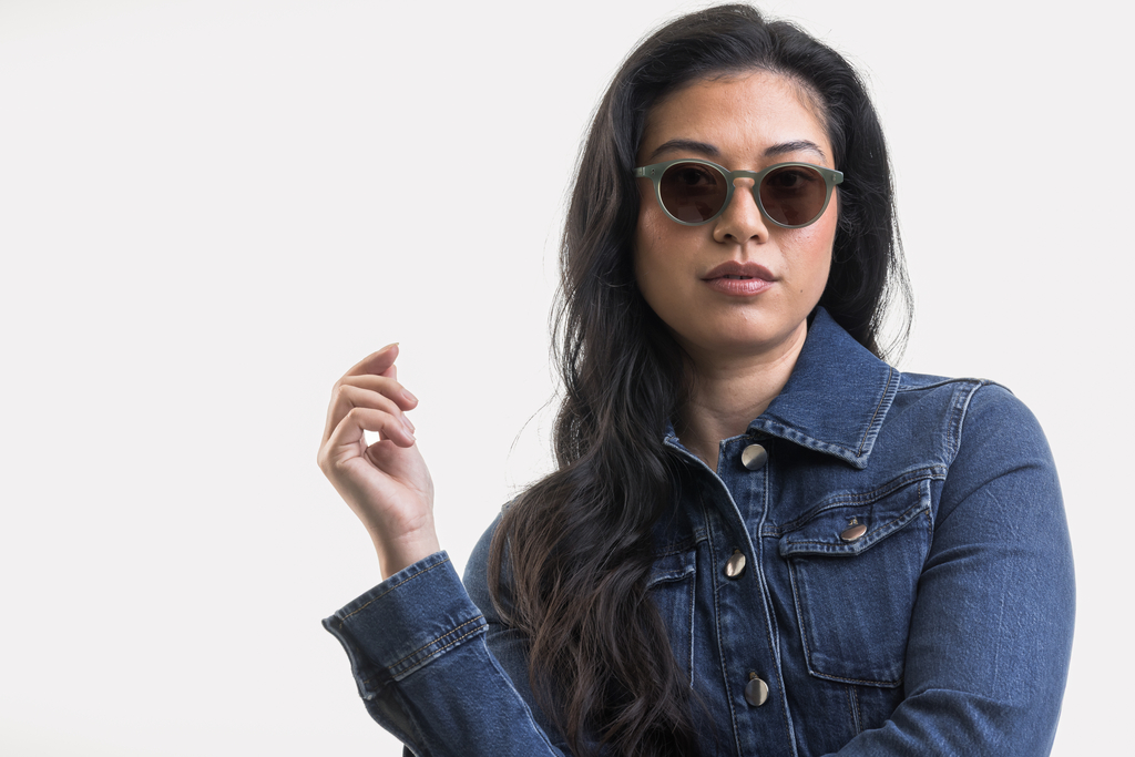 female model wearing Bell sunglasses in Khaki Green with Brown Lenses
