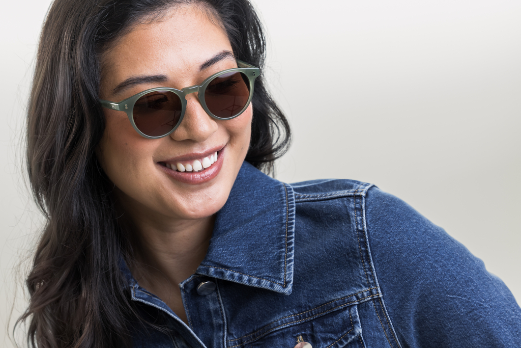 female model wearing Bell sunglasses in Khaki Green with Brown Lenses