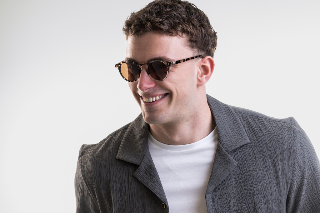 male model wearing Bell sunglasses in Vanilla Tortoise with Brown Lenses