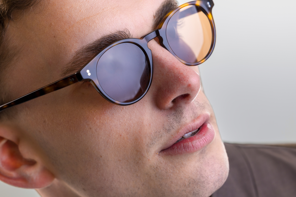 male model wearing Bell sunglasses in Light Medium Havana with Brown Lenses