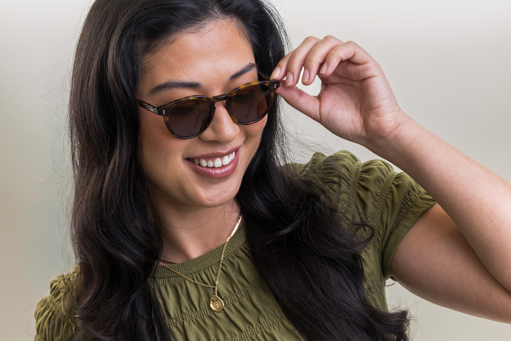 female model wearing Bell sunglasses in Light Medium Havana with Brown Lenses