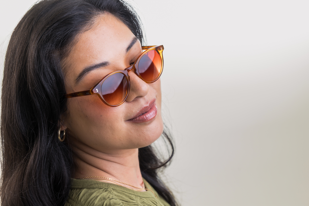 female model wearing Bell Sunglasses in Amber with Sienna Sunset Gradient