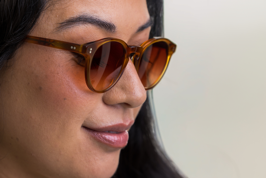 female model wearing Bell Sunglasses in Amber with Sienna Sunset Gradient