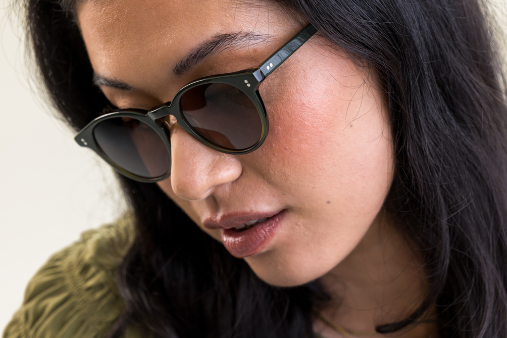 female model wearing Bell sunglasses in Woodland Fade with Brown Polarised Lenses