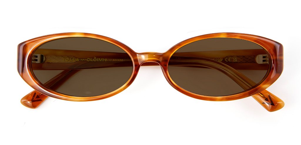 Folded view of 002 Cinnamon Swirl Sunglasses with Brown Lenses