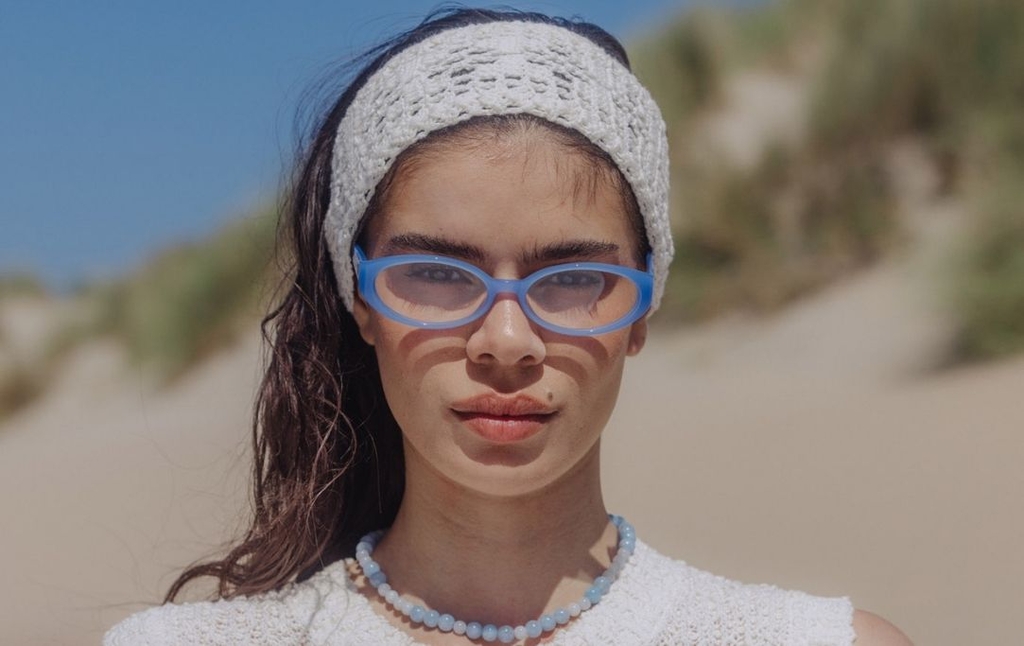 Model wearing 002 Icy Blue Glasses front view