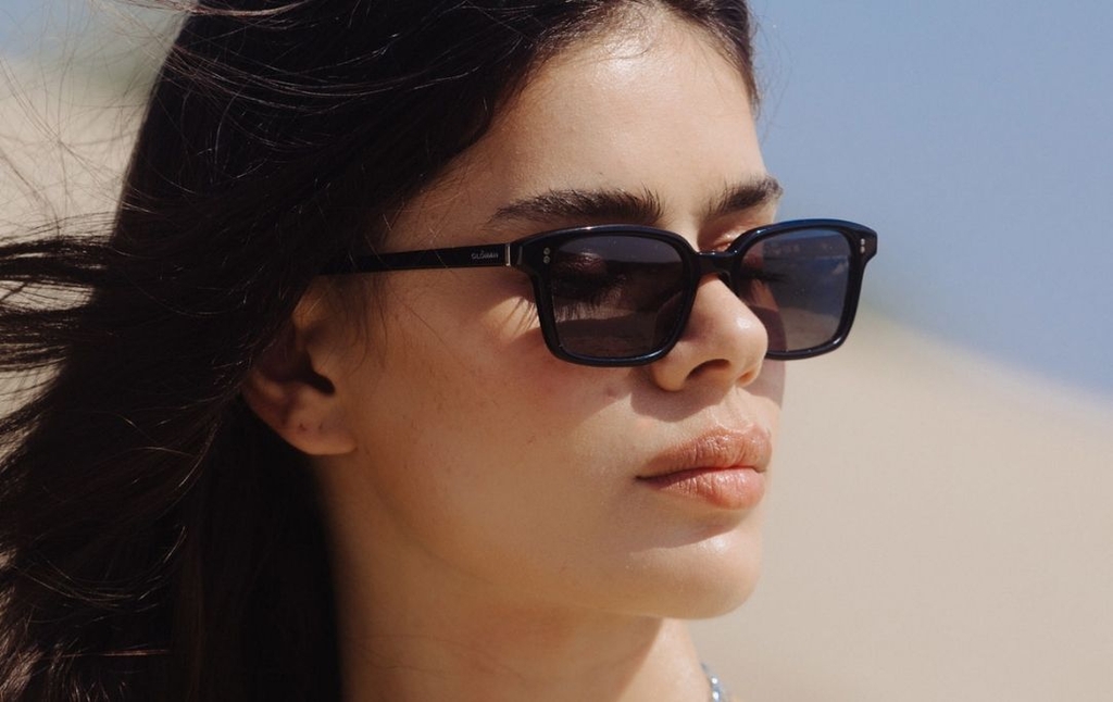 Model wearing 001 Black Sunglasses with Grey Lenses side profile