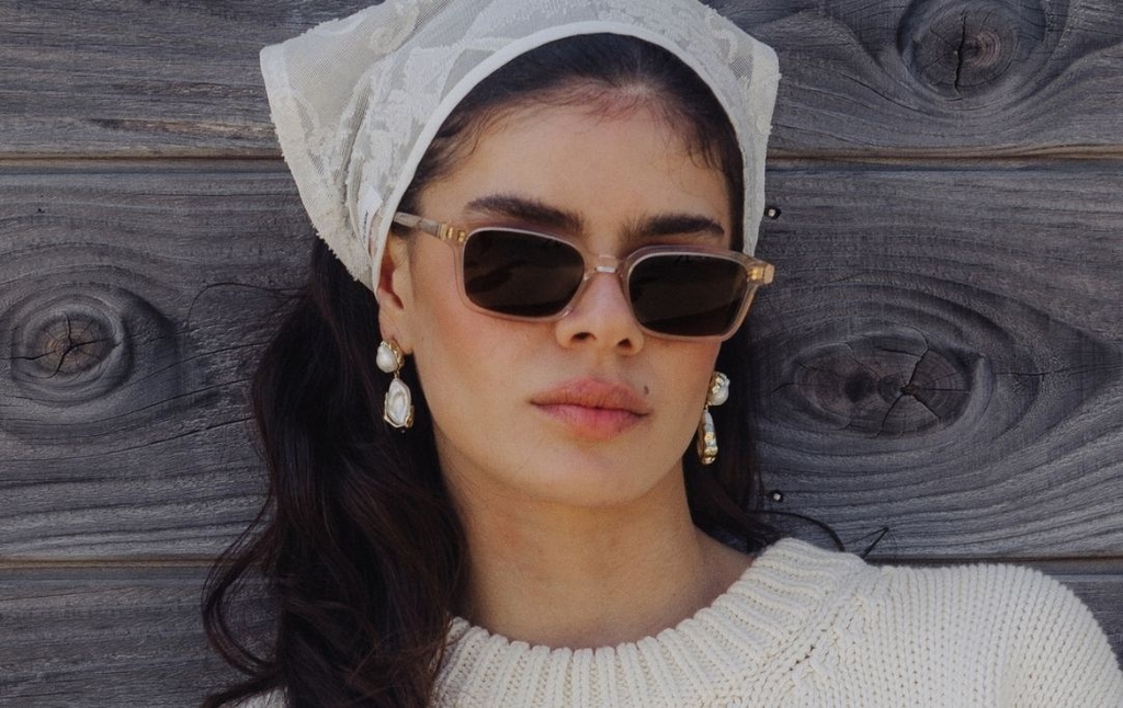 Model wearing 001 Vanilla Crystal Sunglasses with Brown Lenses side profile
