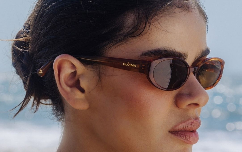 Model wearing 002 Cinnamon Swirl Sunglasses with Brown Lenses side profile