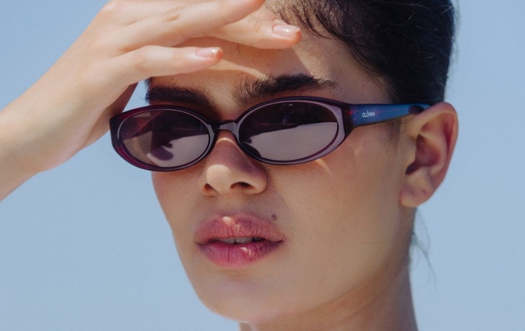 Model wearing 002 Merlot Sunglasses with Brown Lenses front profile