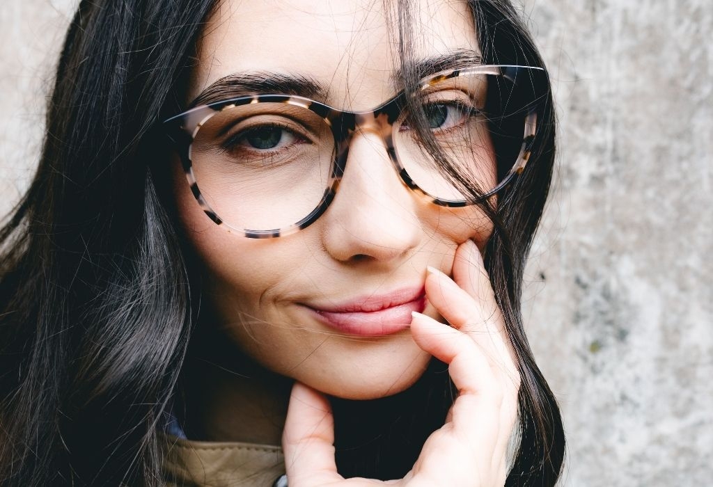 Female model wearing Crawford Vanilla Tortoise Glasses close-up