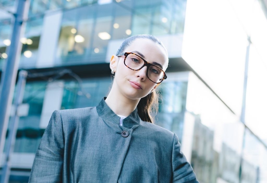 Female model wearing Lachlan Deep Havana Glasses front view smiling