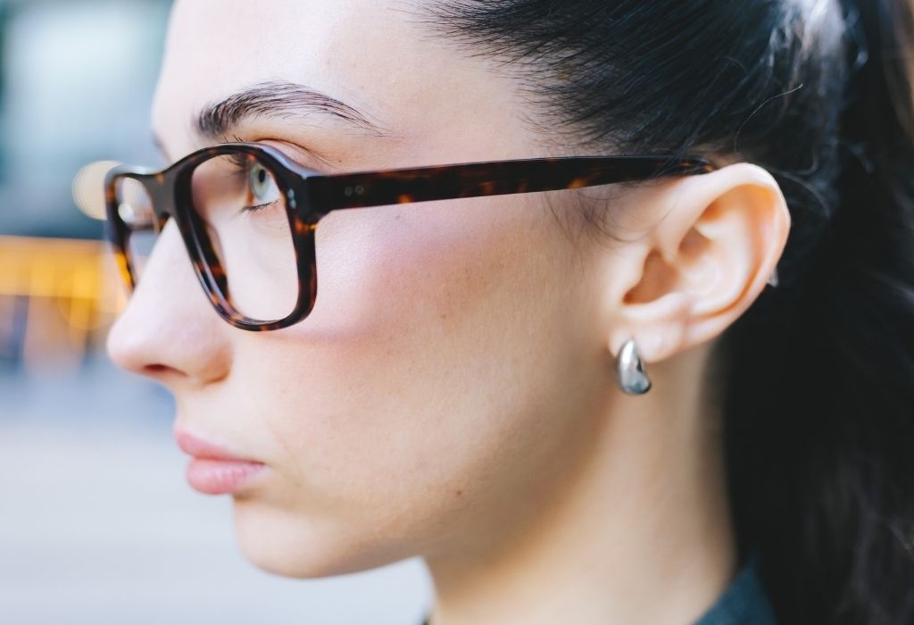 Female model wearing Lachlan Deep Havana Glasses side profile