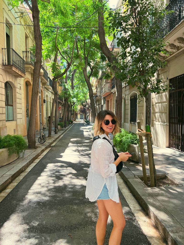 Woman in large round sunglasses on Europe streets