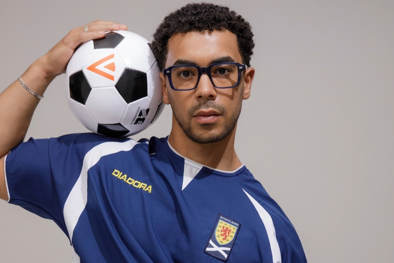 Male model wearing IOLLA Angus glasses in Stone Blue