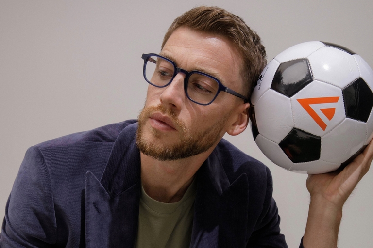 Male model wearing IOLLA Boyd Glasses in Stone Blue