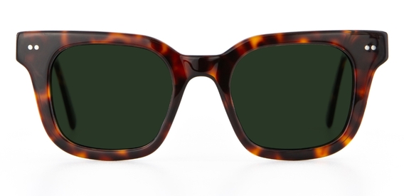 Dark tortoiseshell IOLLA sunglasses with green lenses facing sideways on white background