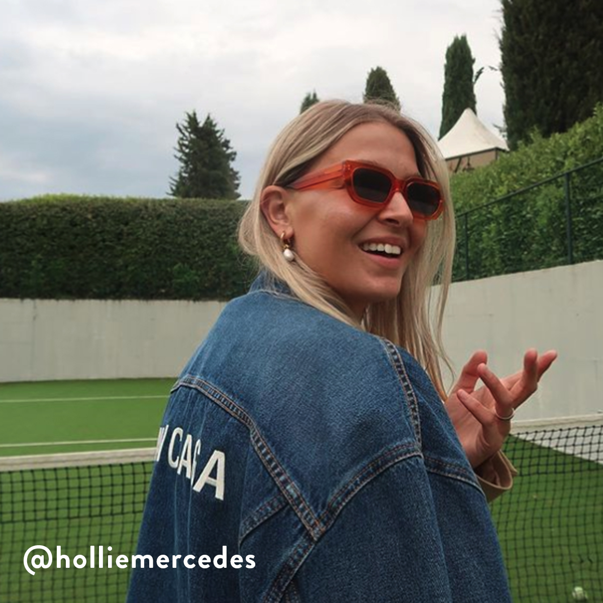 Hollie Mercedes wearing Shaw Orange Crystal glasses looking over her shoulder