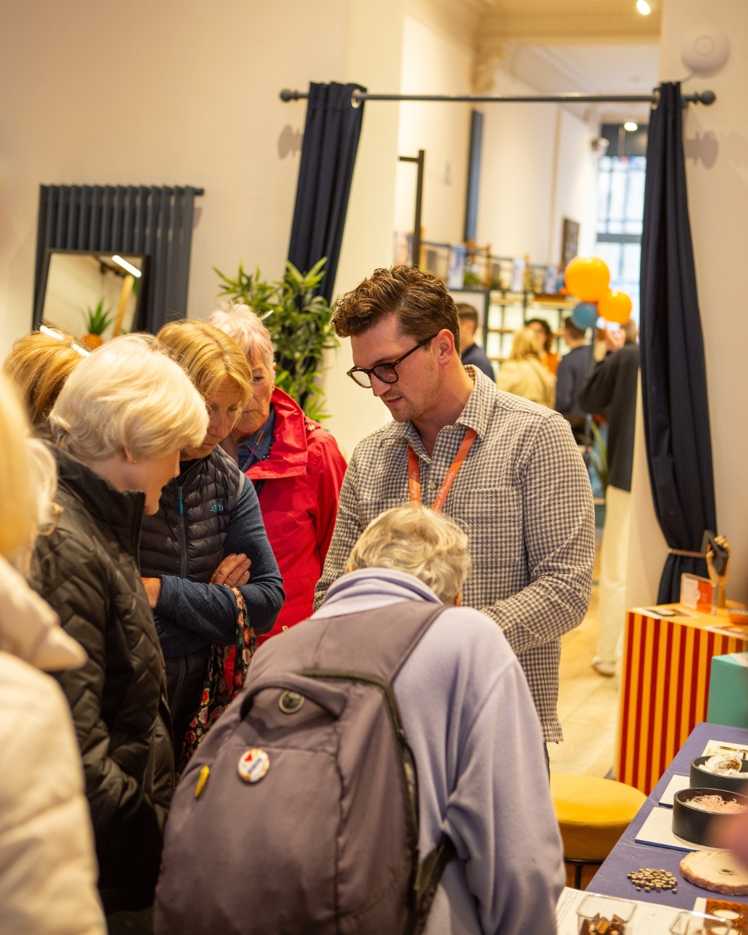 Visitors from doors open day speaking with IOLLA Founder