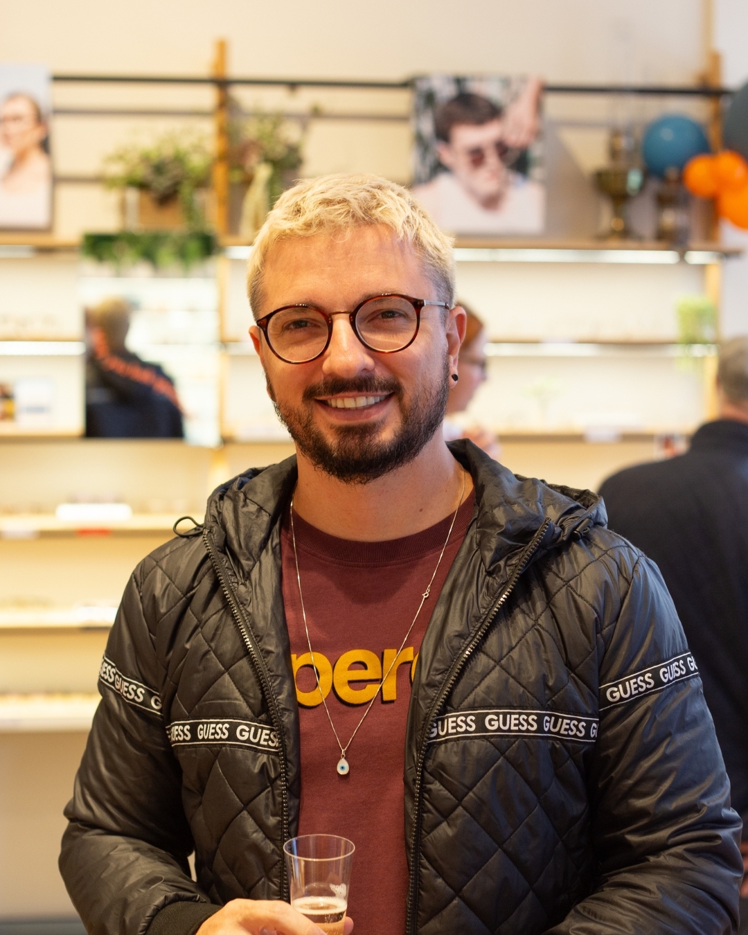 IOLLA customer in showroom wearing glasses