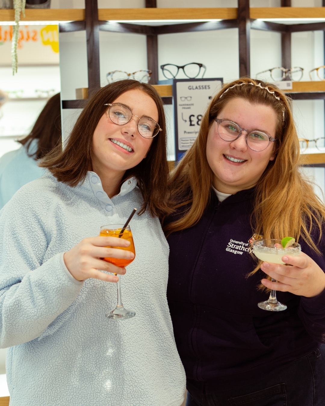 IOLLA customers wearing IOLLAs in showroom