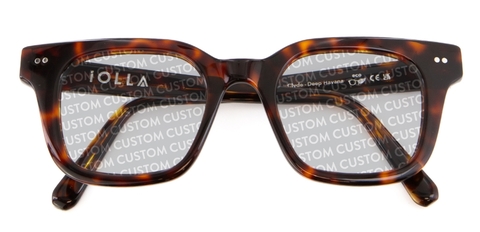 Dark tortoiseshell IOLLA folded sunglasses with custom writing on lenses on white background