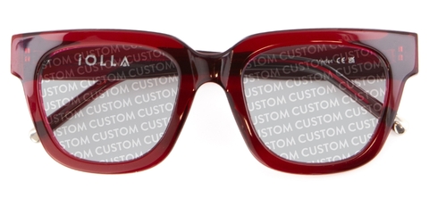 Red IOLLA frames folded with custom written on lenses on white background