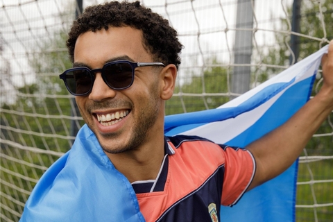 Male model showcasing IOLLA Boyd Stone Blue Sunglasses with Grey Lenses