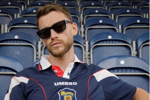Male model showcasing IOLLA Maclean Stone Blue Sunglasses with Grey Lenses