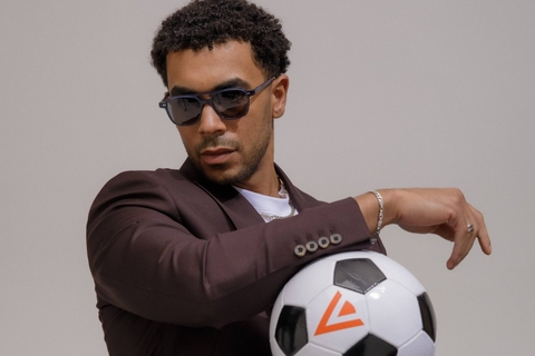 Male model showcasing IOLLA Ramsay Stone Blue Sunglasses with Grey Lenses