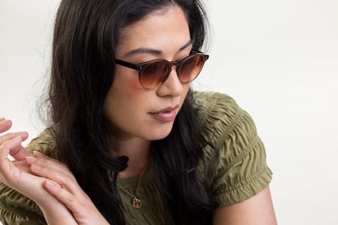 female model wearing Bell sunglasses in Cola Fade with Sienna Sunset gradient