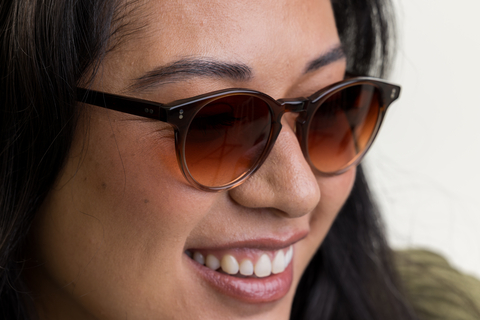 female model wearing Bell sunglasses in Cola Fade with Sienna Sunset gradient