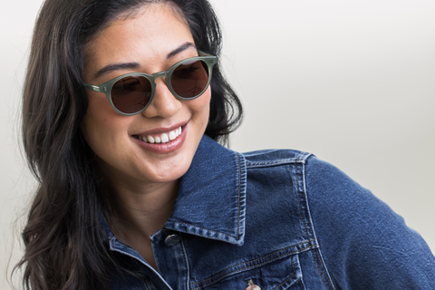 female model wearing Bell sunglasses in Khaki Green with Brown Lenses