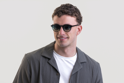 male model showcasing Bell. Sunglasses in Black with Lagoon Haze Gradient
