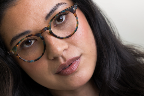 female model wearing Bell Matte Ocean Tortoise Glasses