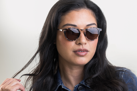 female model wearing Bell sunglasses in Vanilla Tortoise with Brown Lenses