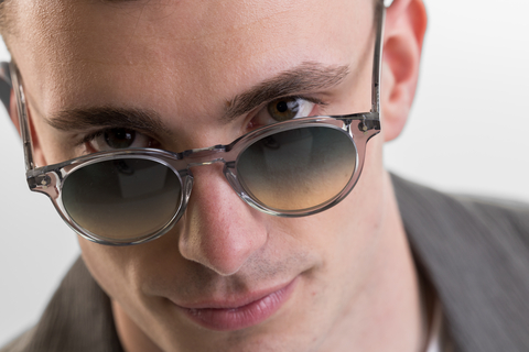 male model wearing Bell sunglasses in Light Grey Crystal with Lagoon Haze Gradient