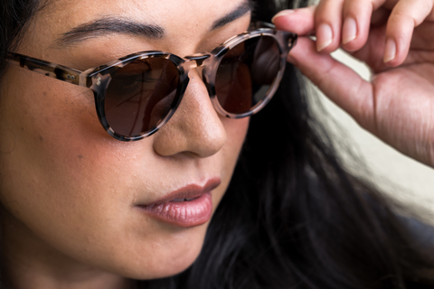 female model wearing Bell sunglasses in Vanilla Tortoise with Brown Lenses