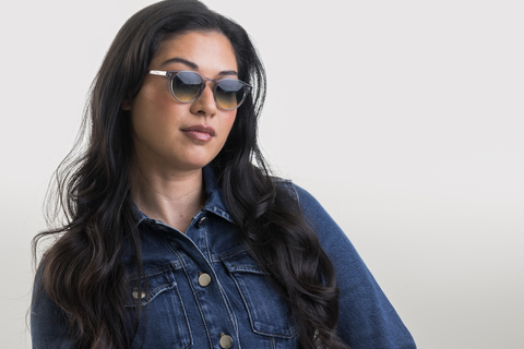 female model wearing Bell sunglasses in Light Grey Crystal with Lagoon Haze Gradient