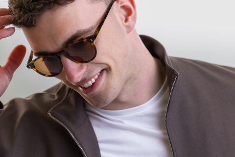 male model wearing Bell sunglasses in Light Medium Havana with Brown Lenses
