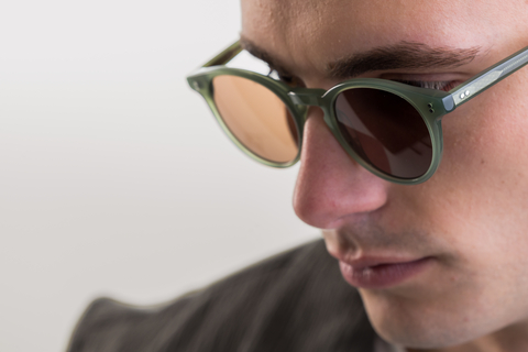 male model wearing Bell sunglasses in Khaki Green with Brown Lenses