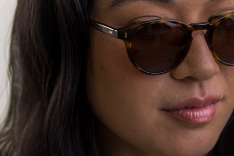 female model wearing Bell sunglasses in Light Medium Havana with Brown Lenses