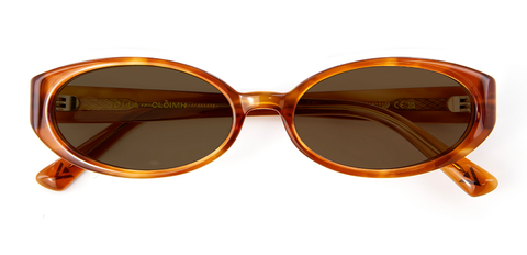 Folded view of 002 Cinnamon Swirl Sunglasses with Brown Lenses