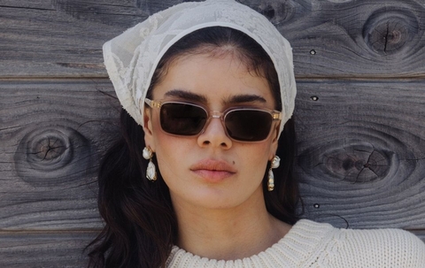 Model wearing 001 Vanilla Crystal Sunglasses with Brown Lenses front profile