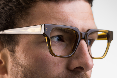Male model wearing Macrae glasses in husk crystal side profile view
